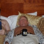 three men in a bed